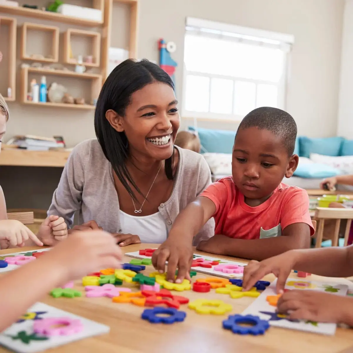 Teacher smiling with students