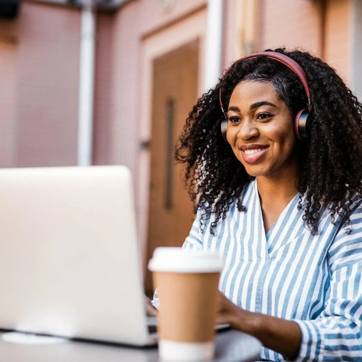 Woman smiling at computer